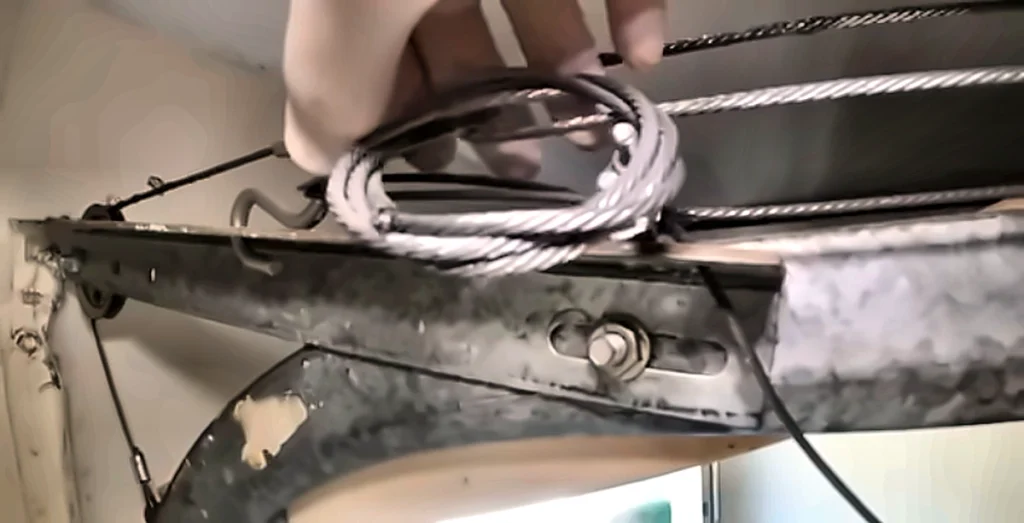 Garage door lift cable and bottom bracket