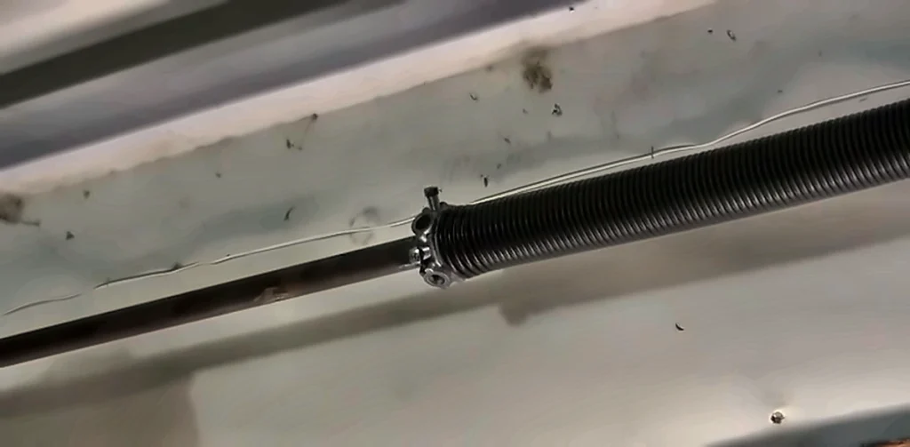 Torsion spring on a garage door shaft